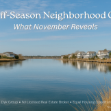 November twilight on an LBI lagoon with soft dock lights reflecting on calm water; quiet street in the background.