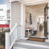 Welcoming entry of an LBI vacation rental with an open door, keypad, porch light, and organized drop zone for arriving guests.