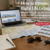 Planning an LBI group rental trip with maps, laptop, rental listings, and travel notes on a dining table.