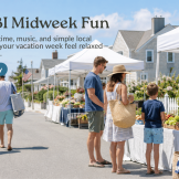 Vacationers browsing a sunny Long Beach Island-style farmers market during an easy midweek summer vacation day.
