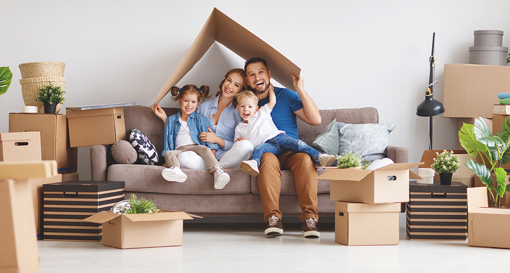 Happy,Family,Mother,Father,And,Children,Move,To,A,New