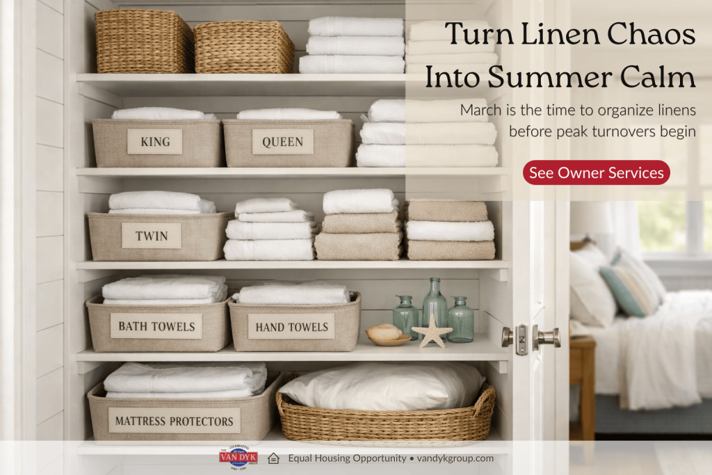 Organized linen closet in an LBI vacation rental with labeled bins, folded towels, sheet sets, and visible guest room ready for summer turnovers.