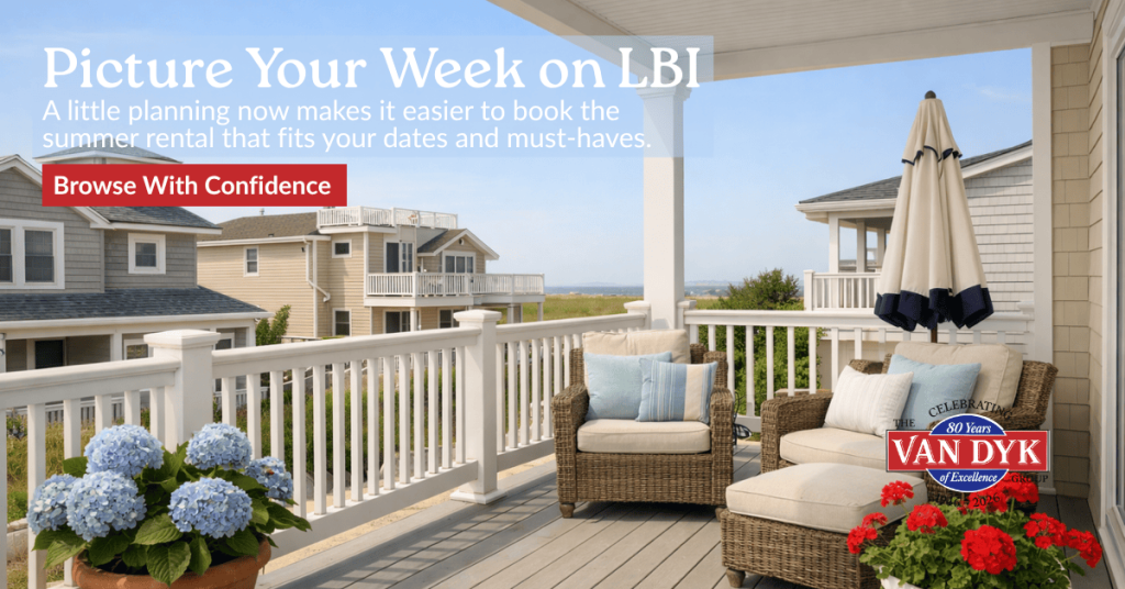 Porch and upper deck of a Long Beach Island summer rental with coastal seating, flowers, and bright vacation-season light