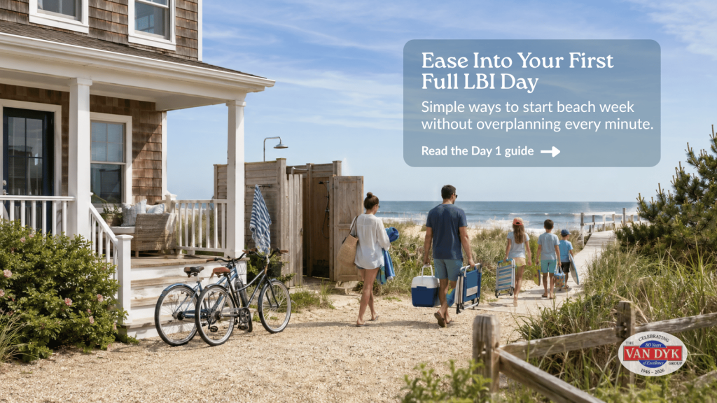 Family walking from an LBI vacation rental to the beach on their first full LBI day with bikes, beach gear, dunes, and ocean views.