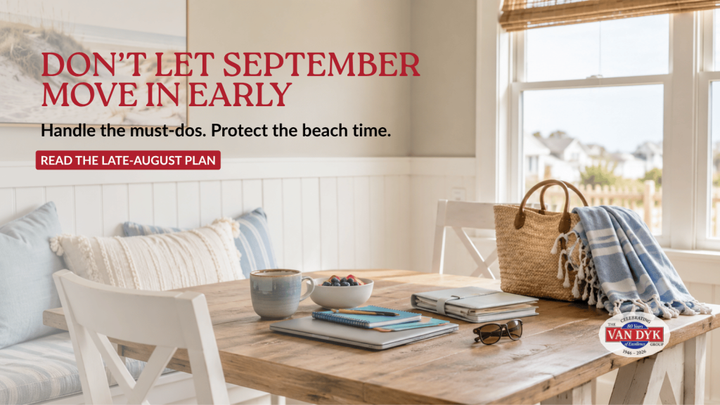 Late-August LBI vacation rental dining area with beach gear, school supplies, laptop and planner ready for back-to-school prep.